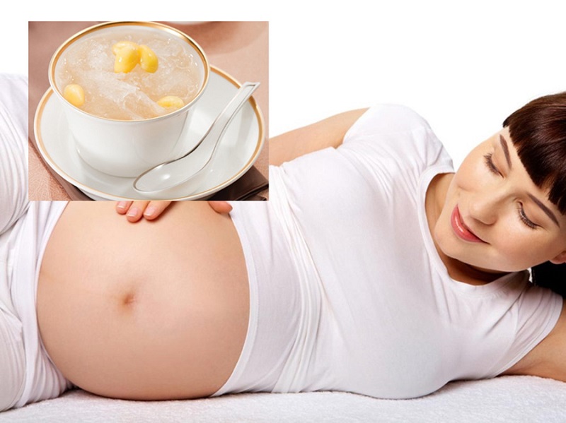 Mang thai và dinh dưỡng: Hình ảnh bà bầu thư giãn bên chén chè hạt sen, một món ăn bổ dưỡng cho sức khỏe mẹ và bé.